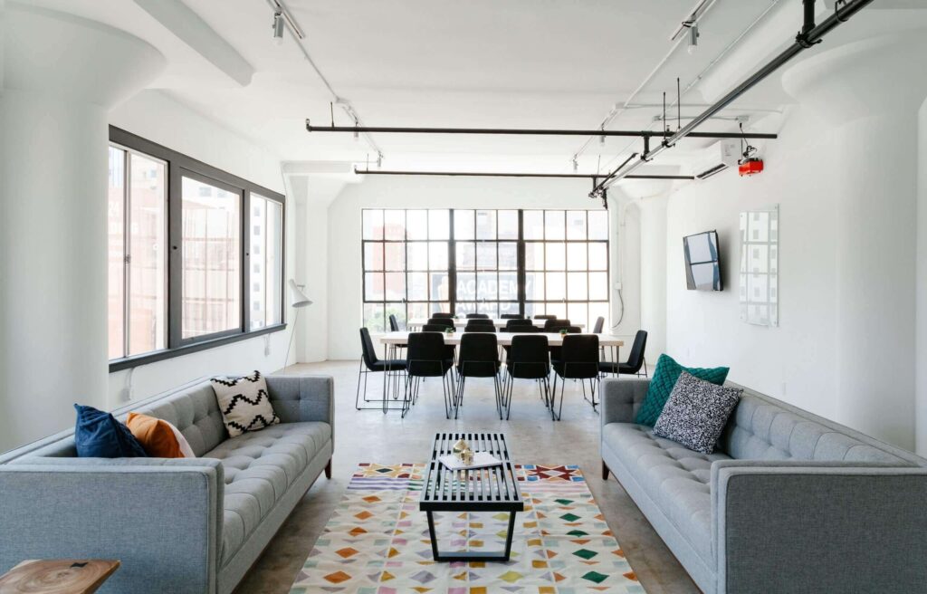 Modern office lounge with meeting area.