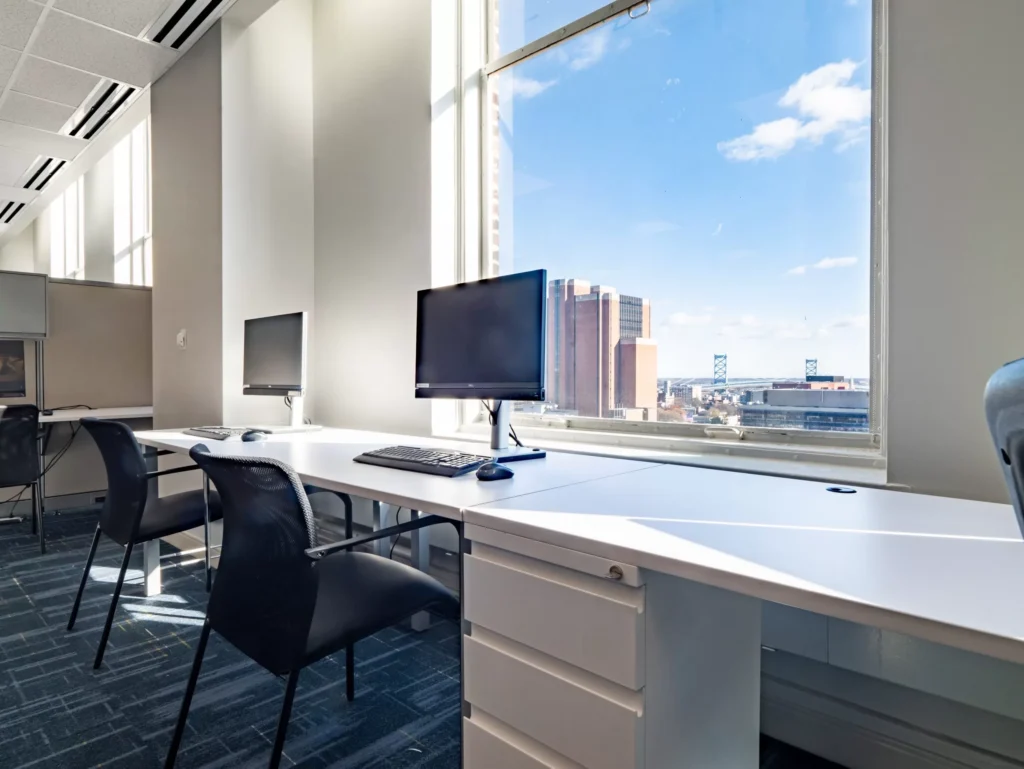 Bright office, city view, workstations.