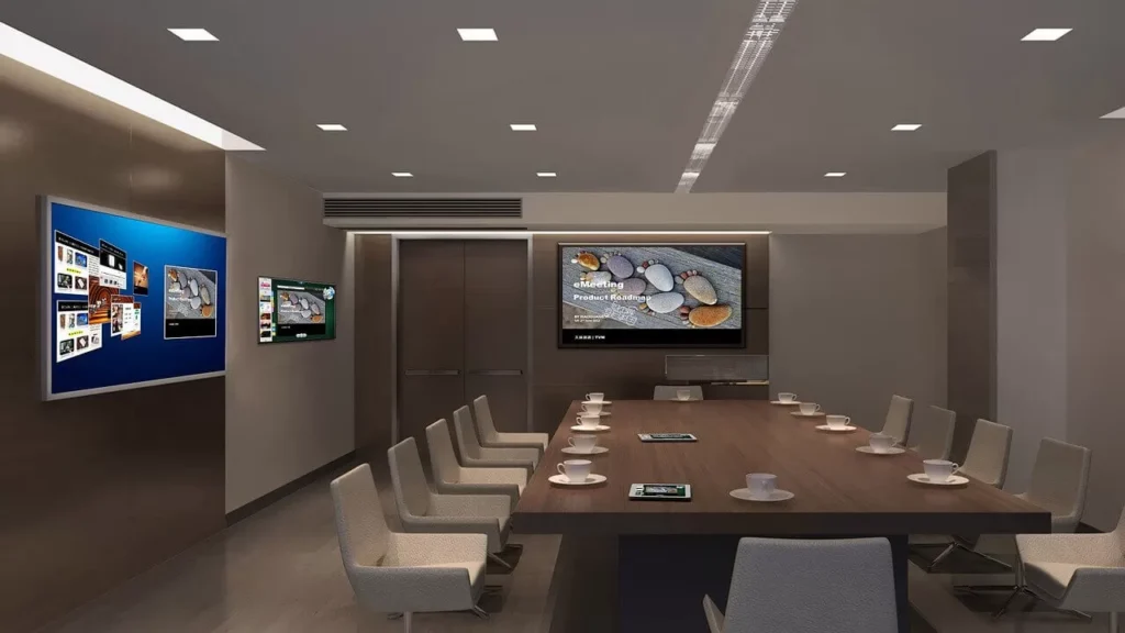 Modern conference room, screens, meeting.