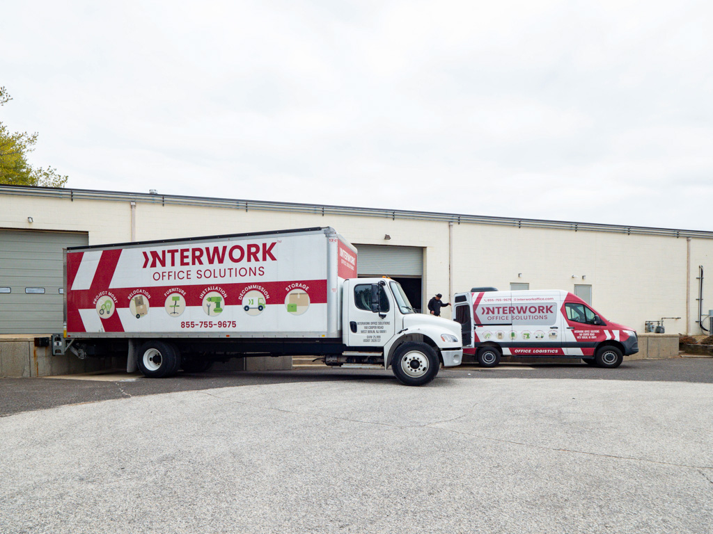 Interwork Office Solutions trucks loading.