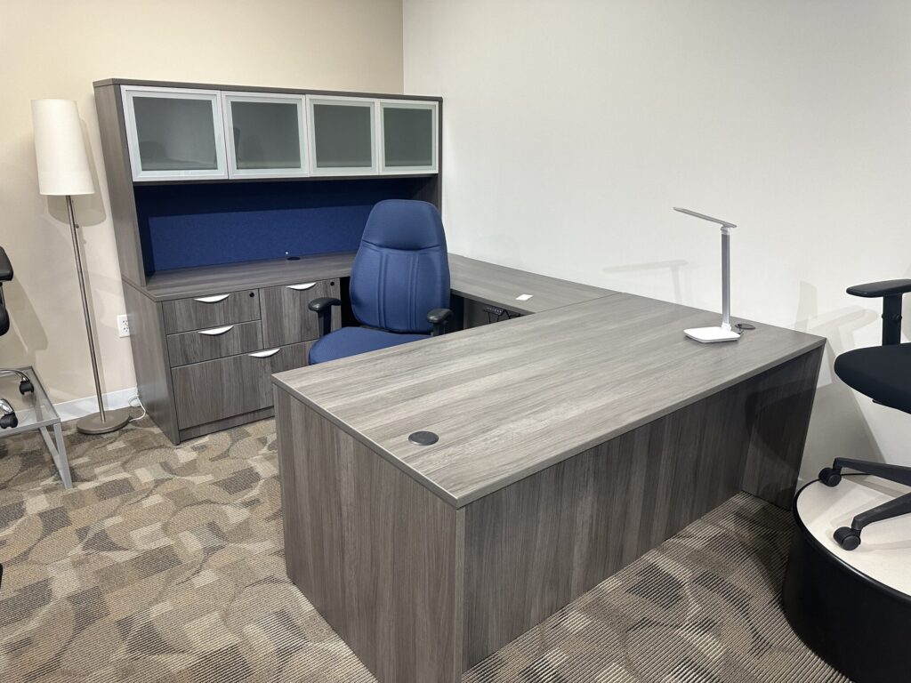 Modern gray L-shaped office desk.