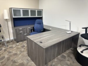 Modern gray L-shaped office desk.